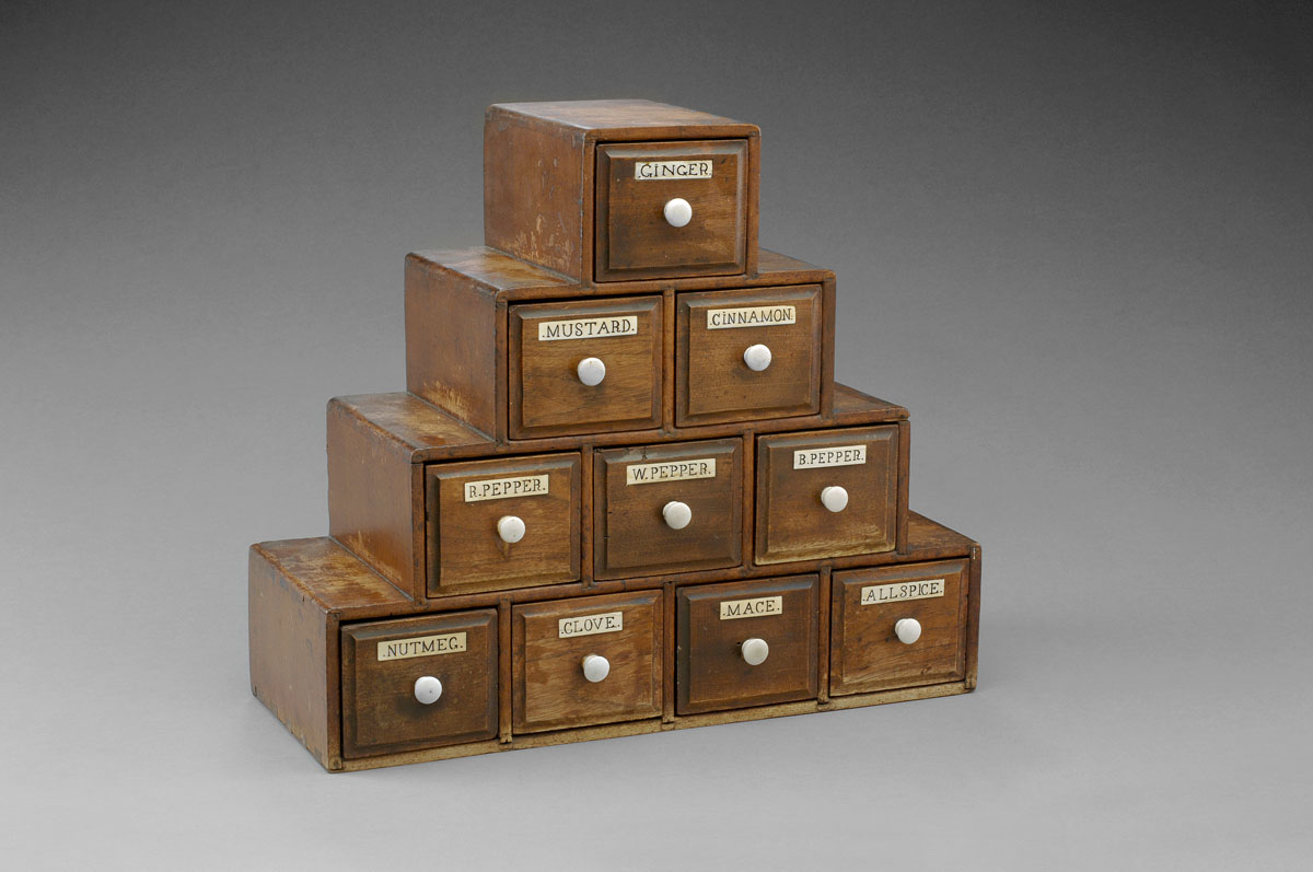 Appraisal: AMERICAN WALNUT PYRAMID FORM SPICE CABINET The dovetailed four tier