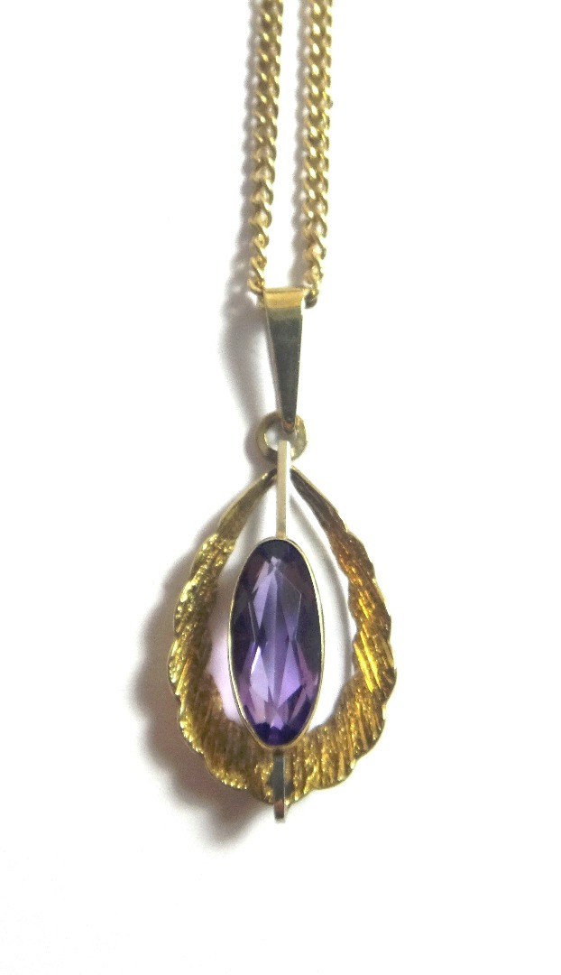 Appraisal: A ct gold and amethyst set single stone pendant mounted