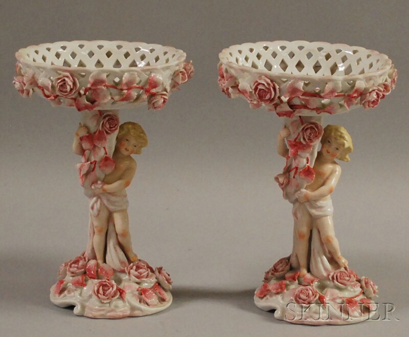 Appraisal: Pair of German Figural Compotes in Red and White each