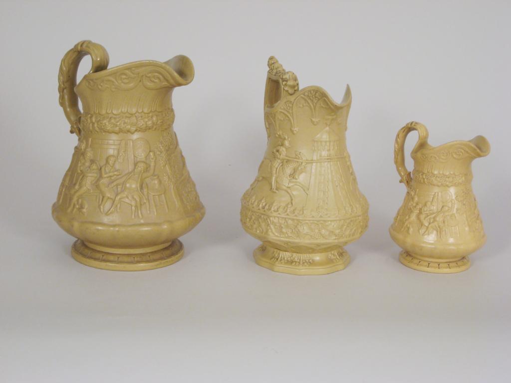 Appraisal: A Victorian Ridgway stoneware Jug moulded warriors on horseback on