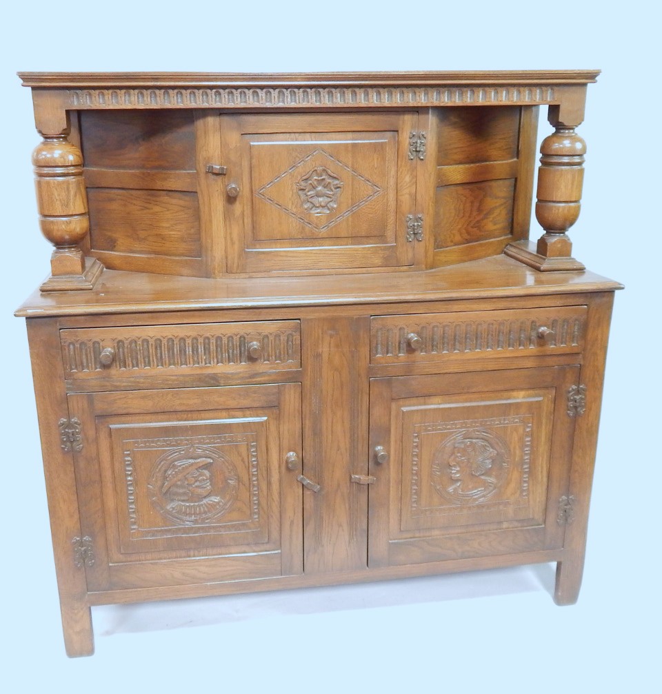 Appraisal: A Weather Furniture linenfold style oak court cupboard having central