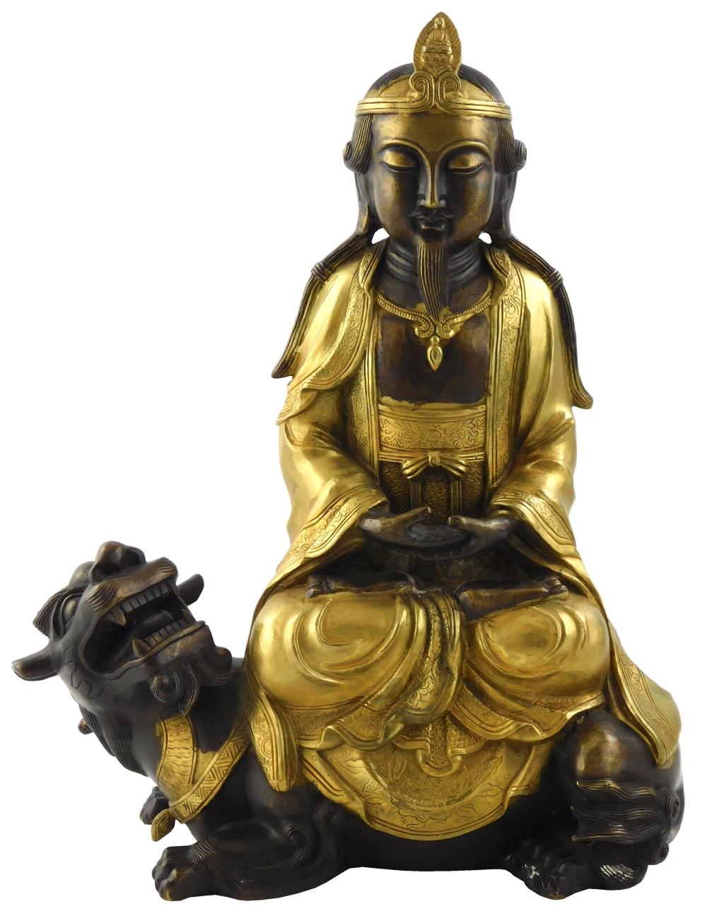 Appraisal: ASIAN PARCEL GILT BRONZE FIGURE OF A DEITY SEATED ATOP