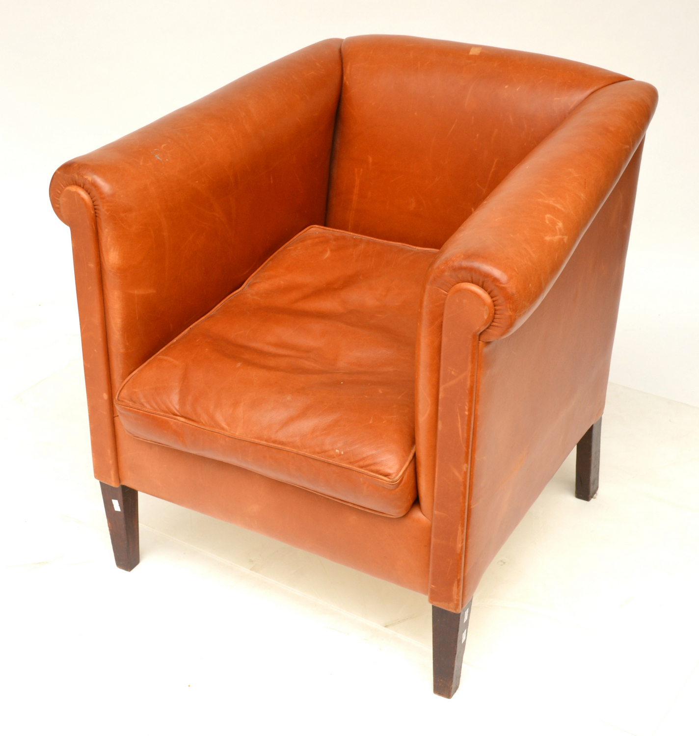 Appraisal: A TAN LEATHER UPHOLSTERED CLUB CHAIR