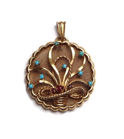 Appraisal: A gold turquoise and cabochon ruby set pendant of shaped