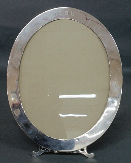 Appraisal: Oval silver picture frame probably sterling h x w