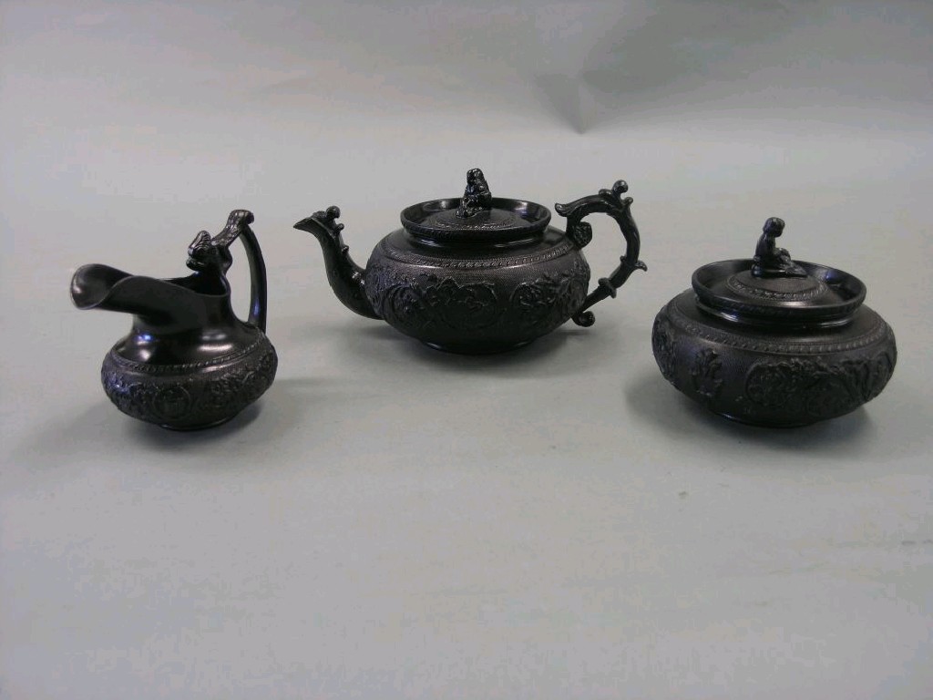 Appraisal: A Cyples pottery tea set consisting of teapot milk jug