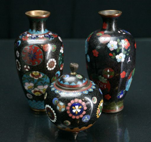 Appraisal: A pair of Japanese cloisonne vases in brocade decoration with