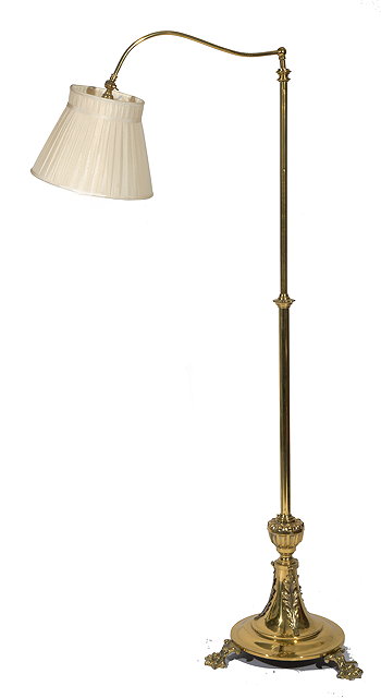 Appraisal: A BRASS READING LIGHT Swan neck tops on a turned