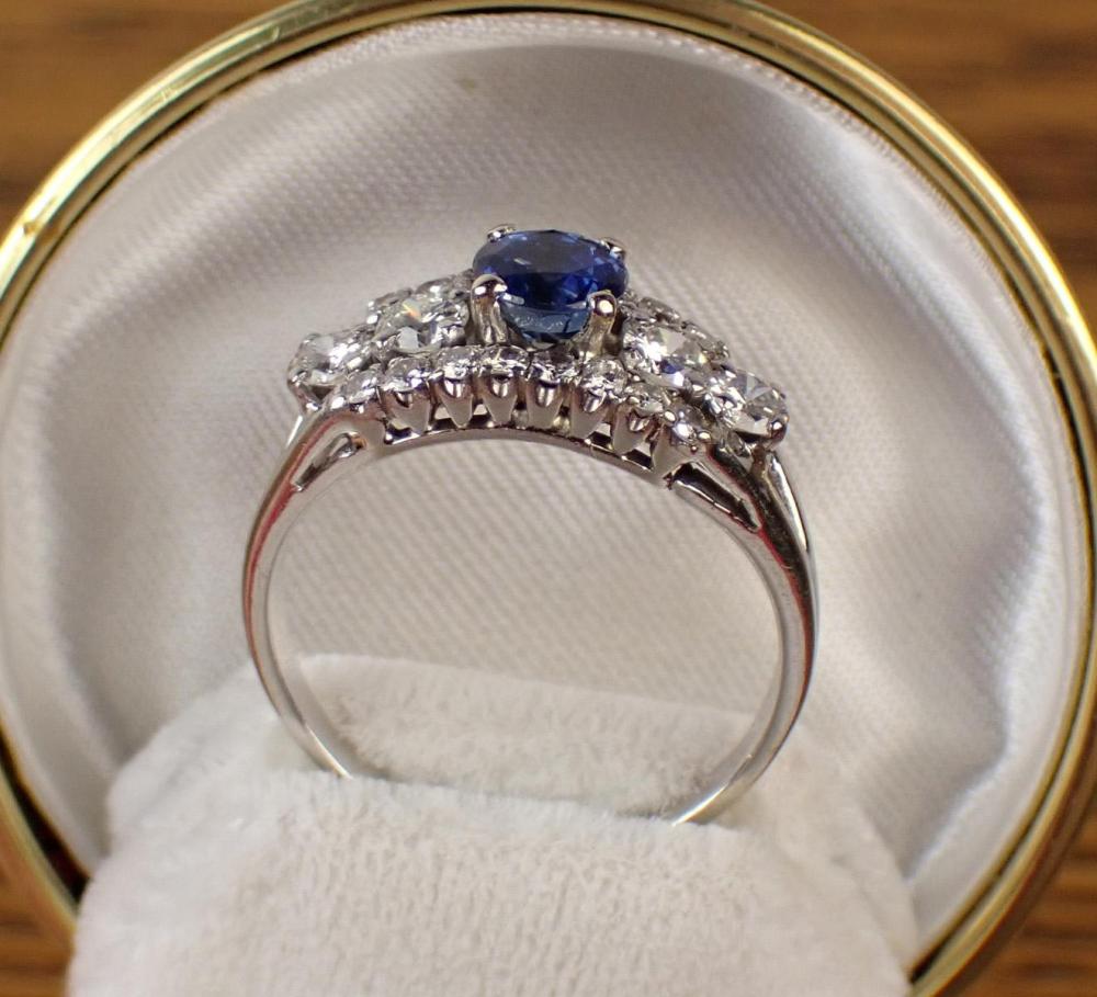 Appraisal: DIAMOND BLUE SAPPHIRE AND FOURTEEN KARAT WHITE GOLD RING centering