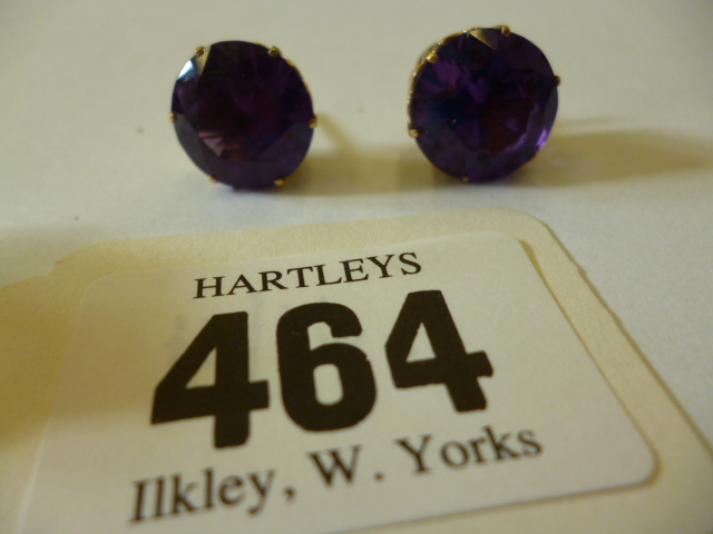 Appraisal: A PAIR OF SYNTHETIC ALEXANDRITE EAR STUDS of round faceted