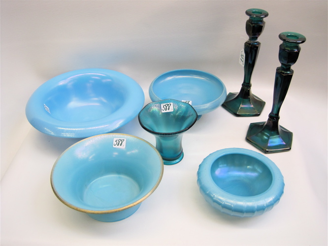 Appraisal: SEVEN PIECES STRETCH GLASS opaque pale blue bowls to D