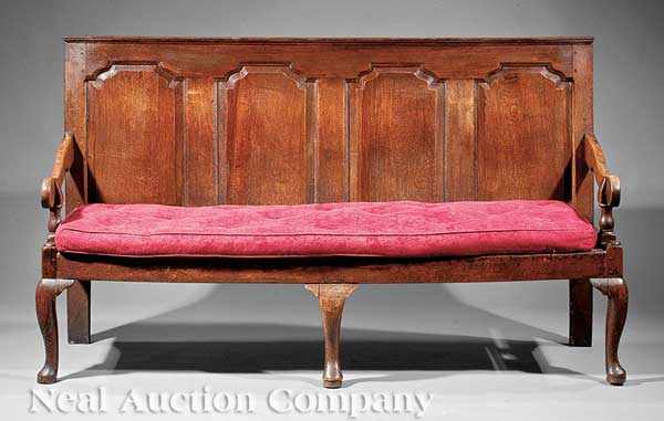 Appraisal: An Antique Georgian Oak Settle c raised panel back scroll