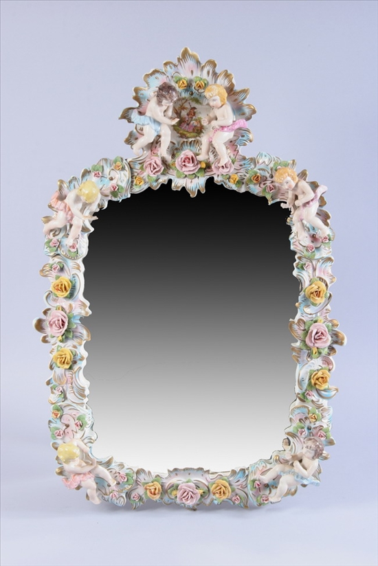 Appraisal: GERMAN PORCELAIN MIRROR th century cartouche shaped with putti and