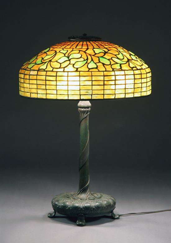 Appraisal: TIFFANY STUDIOS ART GLASS AND BRONZE THREE-LIGHT TABLE LAMP Shade