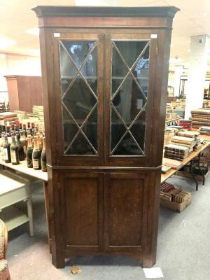 Appraisal: A th Century oak corner cupboard the upper section glazed