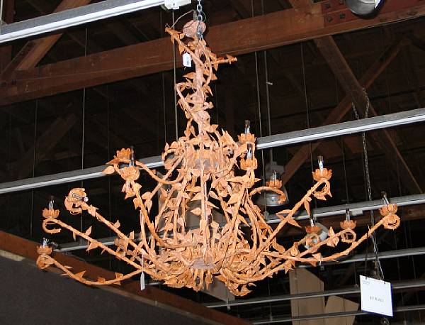 Appraisal: A Rococo style tole sixteen light chandelier Mid- th century