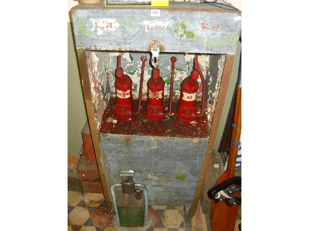 Appraisal: A vintage floor standing oil dispenser with galvanised steel frame