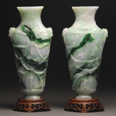 Appraisal: Each vase carved with lion head relief handles and tied