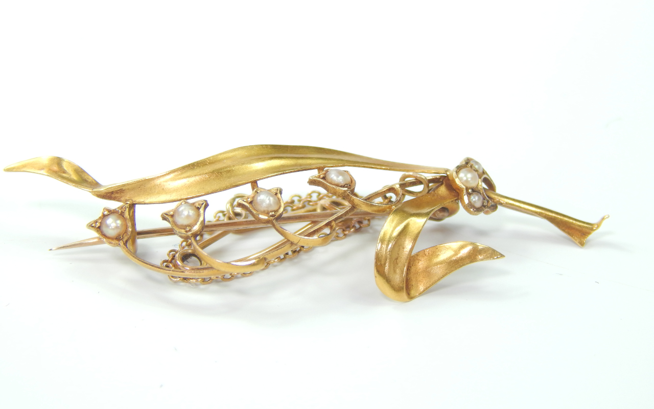 Appraisal: A Victorian yellow metal and seed pearl brooch decorated with