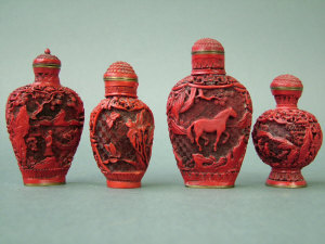 Appraisal: A Chinese simulated cinnabar lacquer snuff bottle and stopper decorated