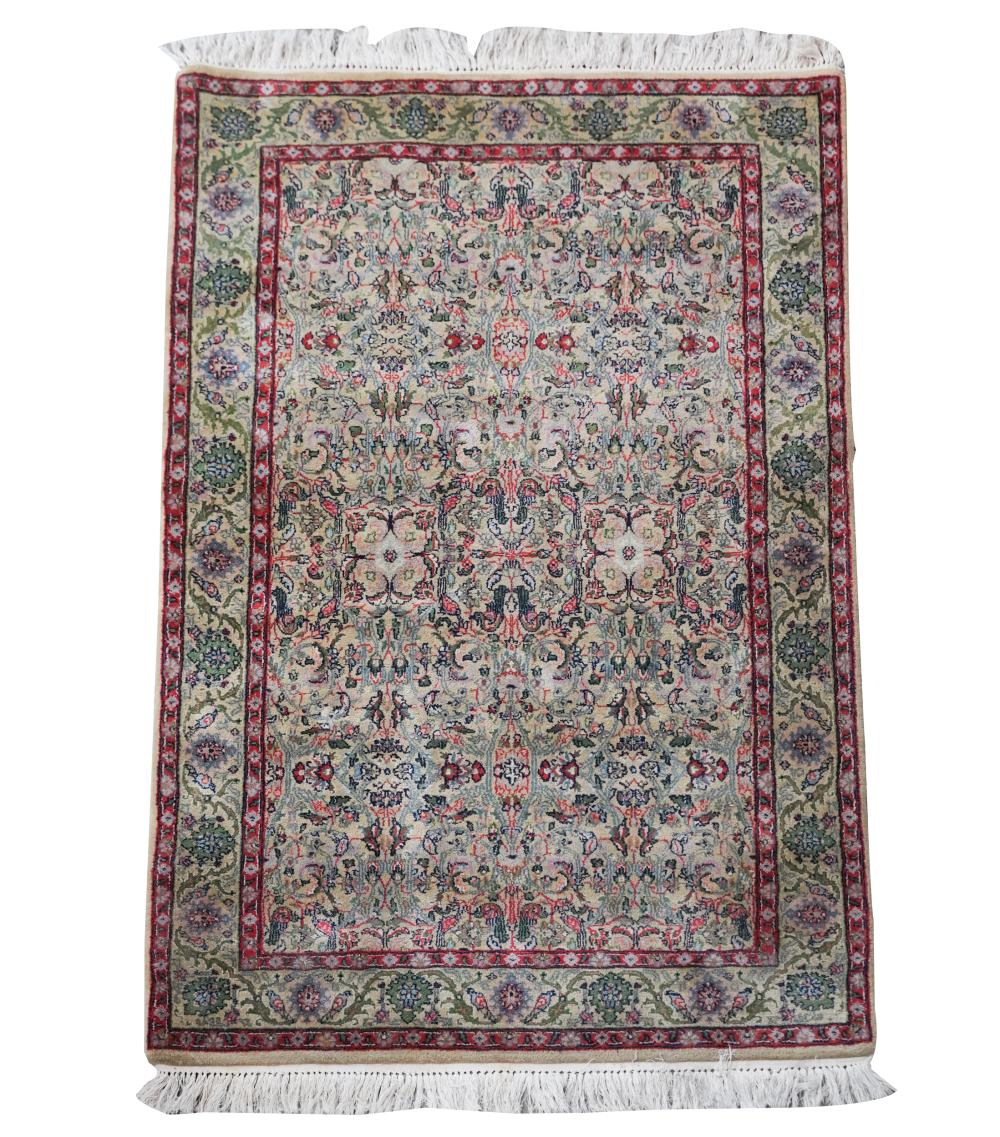 Appraisal: PERSIAN THROW RUGwool pile green field with a double floral