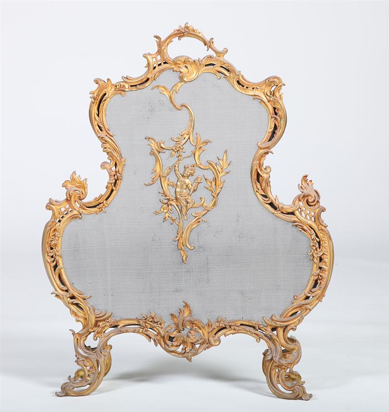 Appraisal: LOUIS XV STYLE GILT-METAL FIRE SCREEN The cartouche-shaped screen centered