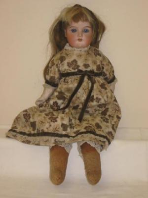 Appraisal: An Armand Marseille bisque shoulder head girl doll with blue