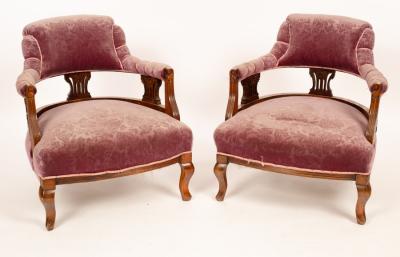 Appraisal: A pair of Edwardian tub-shaped chairs with pierced uprights to