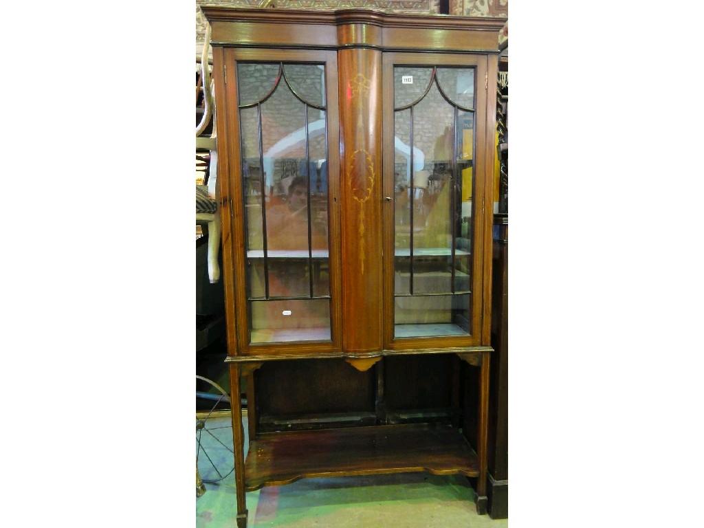 Appraisal: An inlaid Edwardian mahogany display cabinet enclosed by a pair