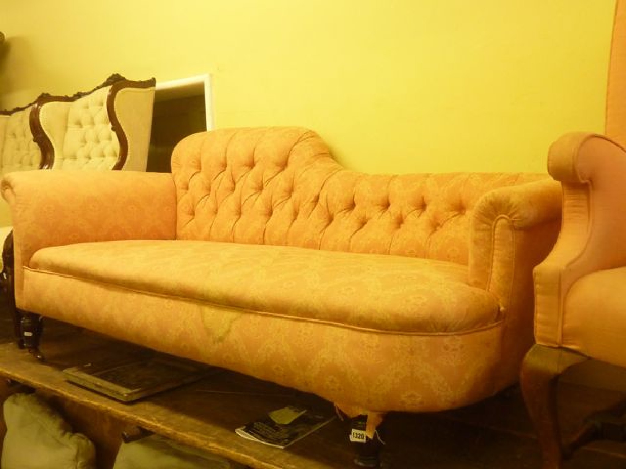 Appraisal: A Victorian couch chaise with floral pattern upholstered seat and