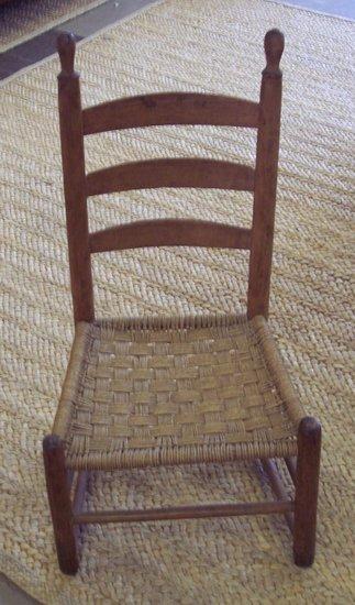 Appraisal: A th Century French Canadian ladder back chair with woven