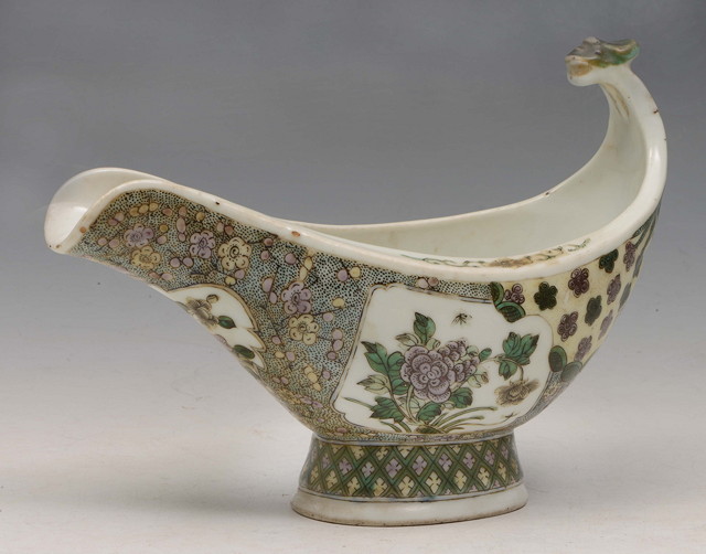 Appraisal: A CHINESE KANGXI STYLE BOAT SHAPED FAMILLE VERTE BISCUIT PORCELAIN