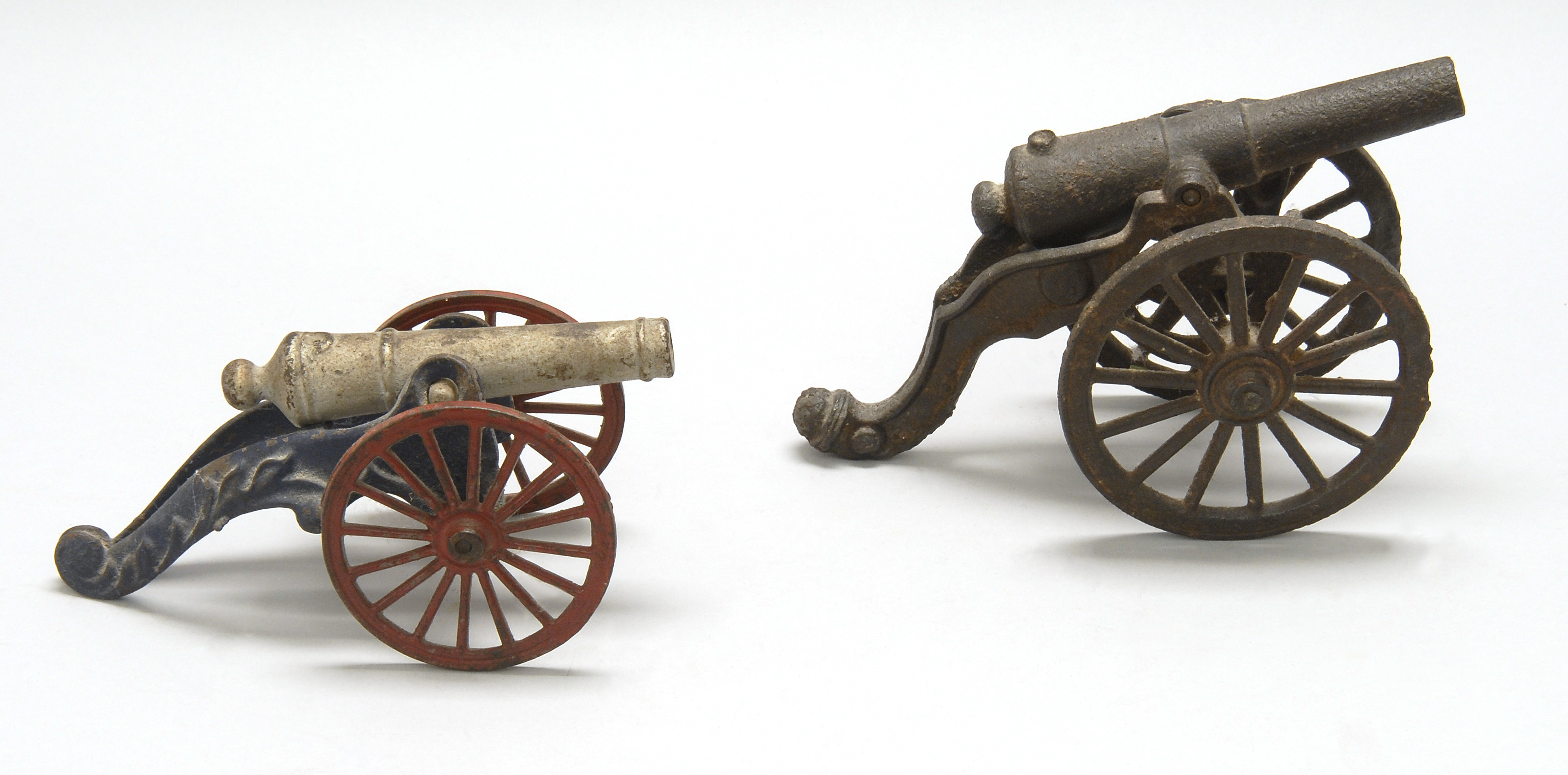 Appraisal: TWO CAST IRON TOY CANNONS th CenturyOne in black paint