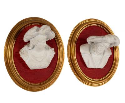 Appraisal: A pair of bisque porcelain wall busts each depicting a