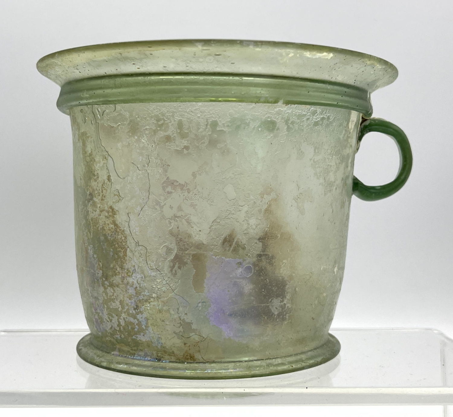 Appraisal: Ancient Handled flared green vessel Roman glass with iridescence Dimensions