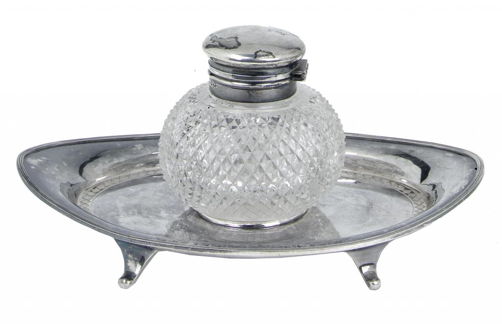 Appraisal: A VICTORIAN NAVETTE SHAPED INKWELL the silver mounted compressed circular