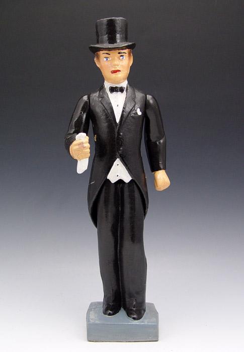 Appraisal: NAUGHTY FOLK ART FIGURE OF AN ELEGANTLY DRESSED MAN In