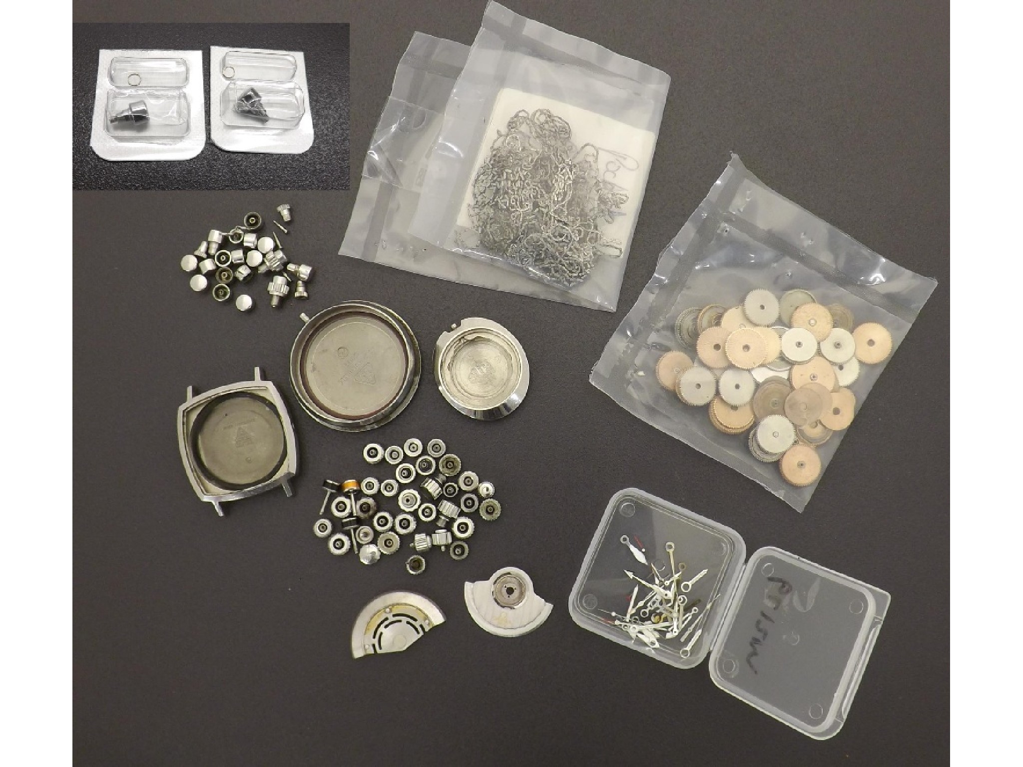 Appraisal: Interesting selection of watch parts principally Omega to include two