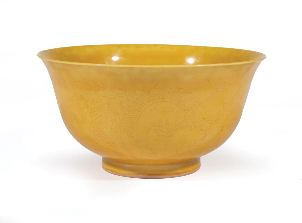 Appraisal: Chinese Yellow Glazed Porcelain Bowl th c incised with confronting