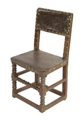 Appraisal: A Charles II joined oak backstool the brass studded leather