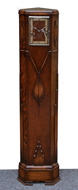 Appraisal: An Art Deco oak corner grandmother clockwith rectangular Roman chapter