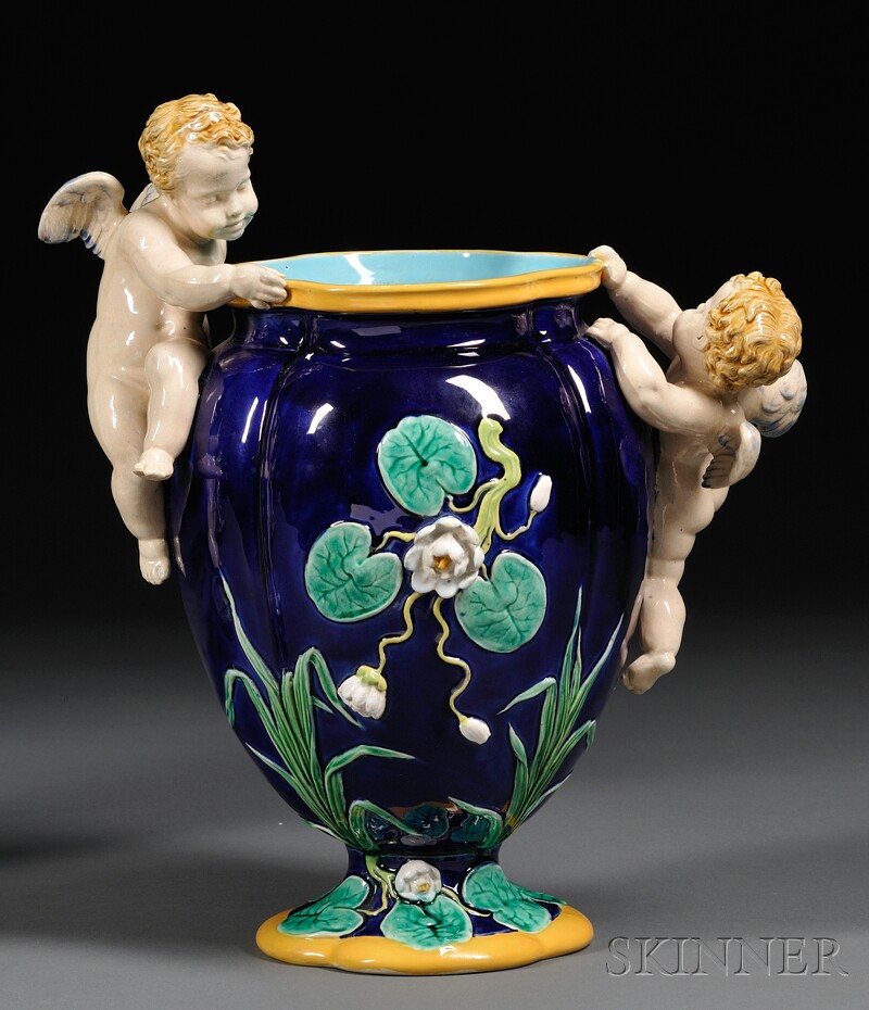 Appraisal: Minton Majolica Vase with Putti England date cipher for vase