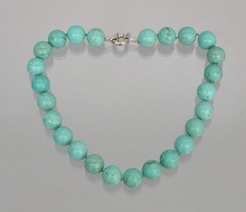 Appraisal: A Strand of Turquoise Composite Beads An inch long strand