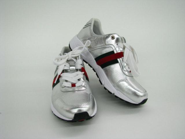 Appraisal: Gucci silver athletic shoes The silver shoe is accented with