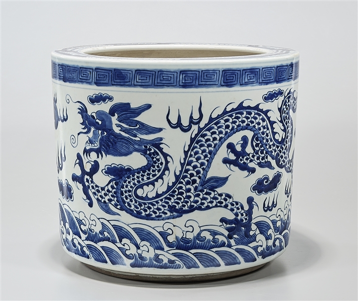 Appraisal: Chinese blue and white porcelain jardiniere depicting dragons chasing pearls