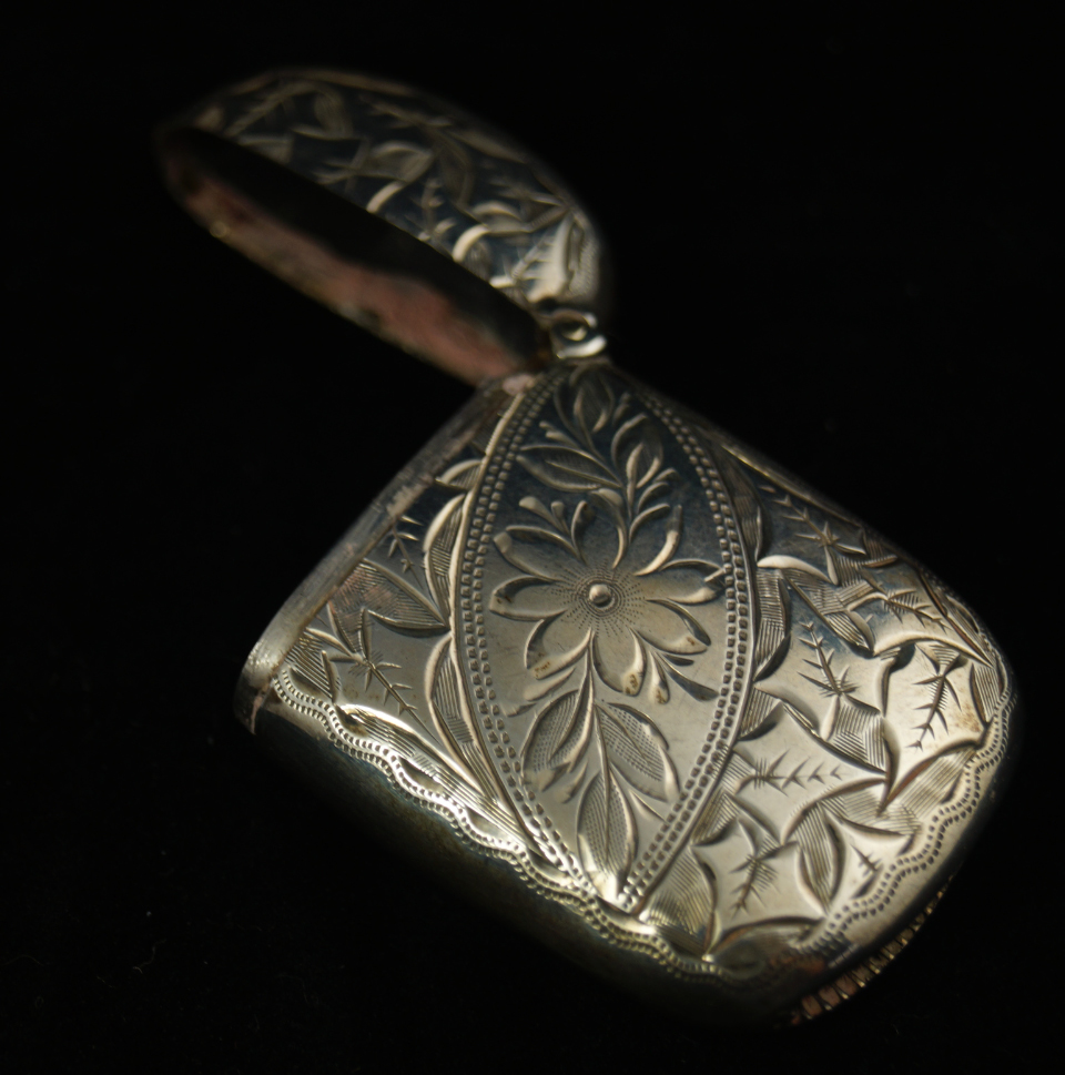 Appraisal: A Victorian silver vesta case with floral and foliate engraved