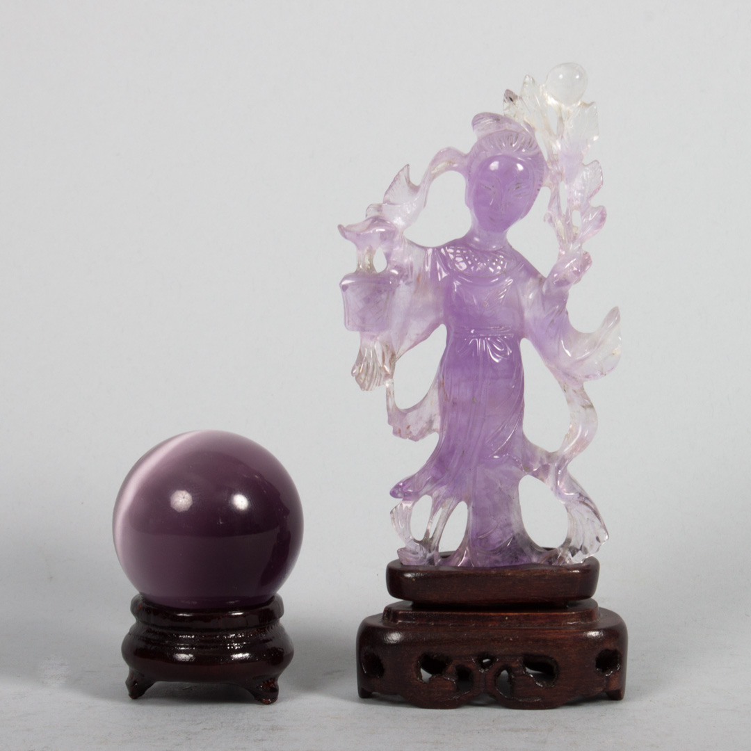 Appraisal: Chinese carved amethyst quartz Quan-Yin with wood base in H