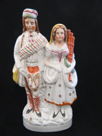 Appraisal: Staffordshire Figurine of Scottish Man Woman with bagpipes