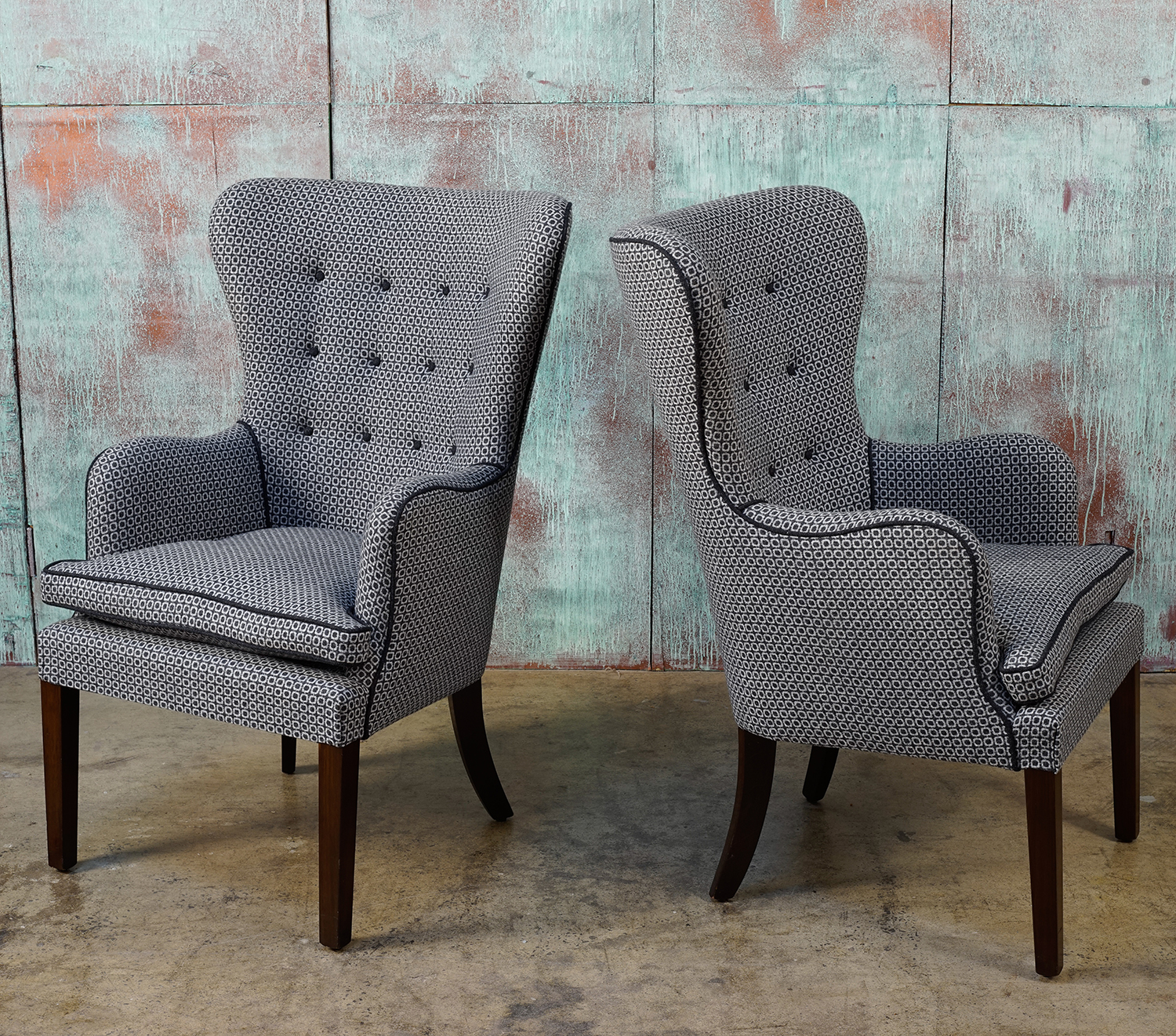 Appraisal: A PAIR OF BESPOKE MID CENTURY INSPIRED ARMCHAIRS Button backed