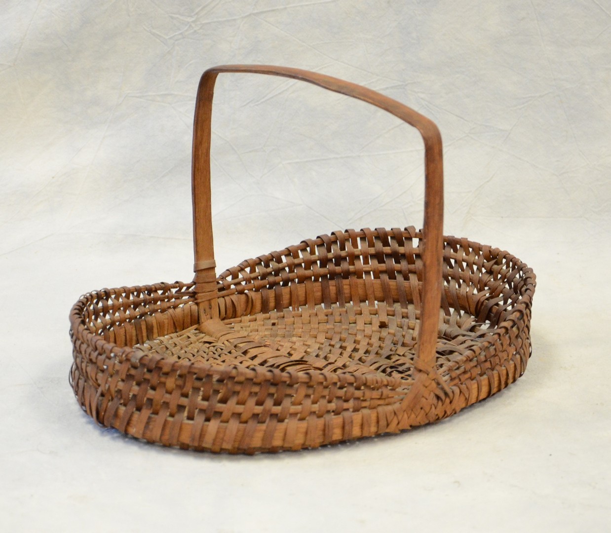 Appraisal: Oak ash splint oval gathering basket high square handle multi-colored